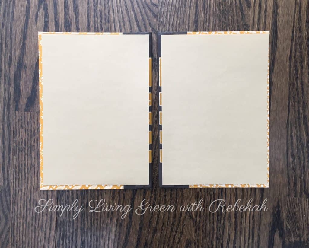 Next, cut decorative or colored paper to coordinate with your book covers and use spray adhesive to glue them on the inside of the front and back covers. 