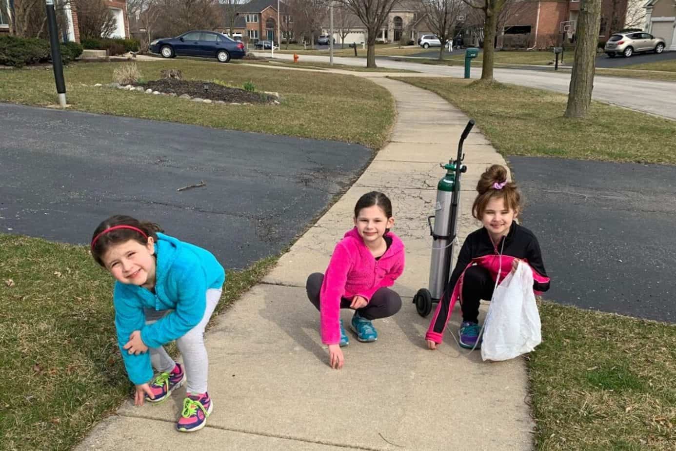 girls doing neighborhood cleanup