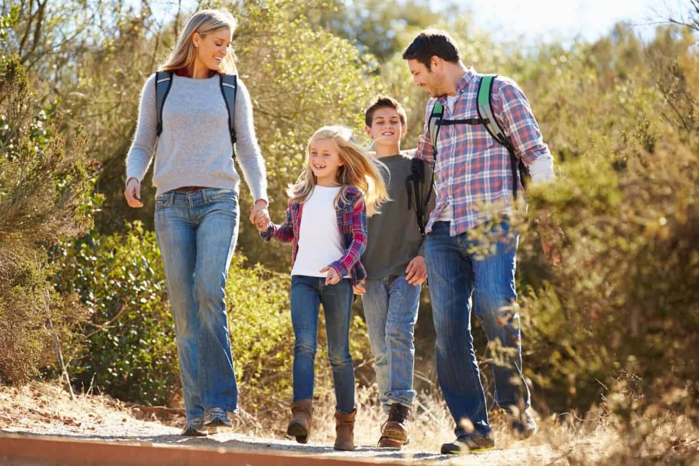 family hiking in the woods